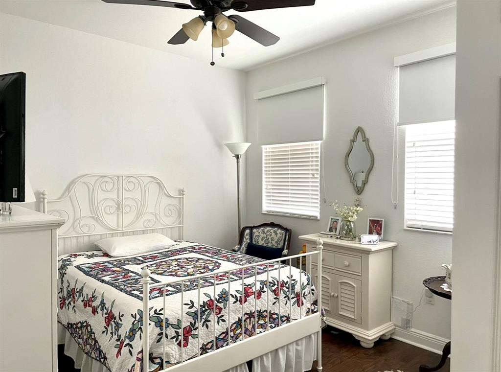 817 Southwest 147th Avenue, Unit 817 Pembroke Pines, FL 33027 - Photo 21 of 34 a bedroom with a bed and a chandelier