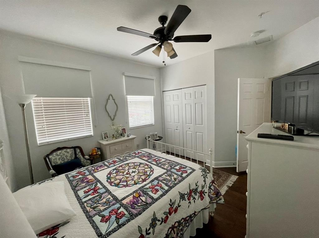 817 Southwest 147th Avenue, Unit 817 Pembroke Pines, FL 33027 - Photo 22 of 34 a bedroom with a bed and a chandelier