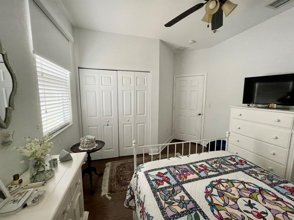 817 Southwest 147th Avenue, Unit 817 Pembroke Pines, FL 33027 - Photo 24 of 34 a bedroom with a bed and flat screen tv