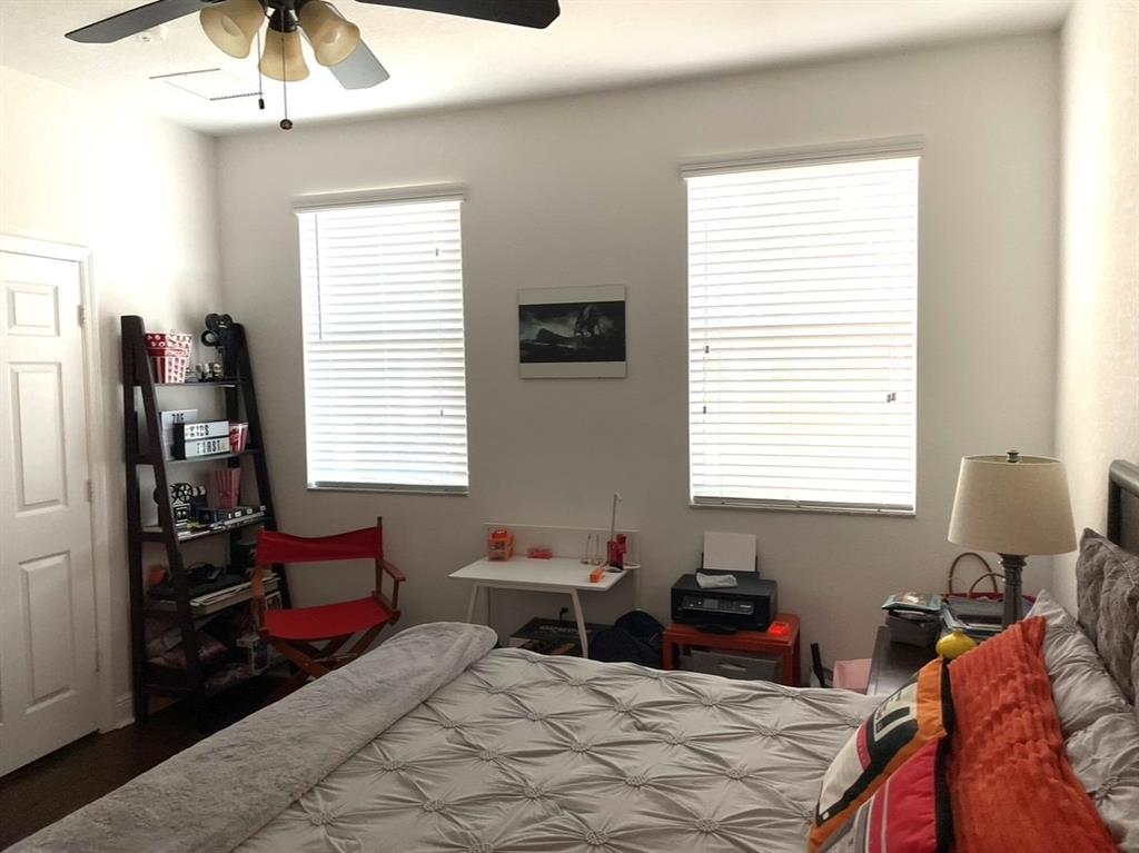 817 Southwest 147th Avenue, Unit 817 Pembroke Pines, FL 33027 - Photo 26 of 34 a bedroom with two beds and a window