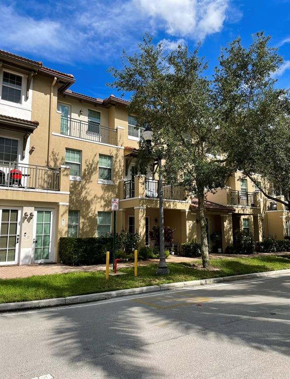 817 Southwest 147th Avenue, Unit 817 Pembroke Pines, FL 33027 - Photo 4 of 34 a view of a building with a street