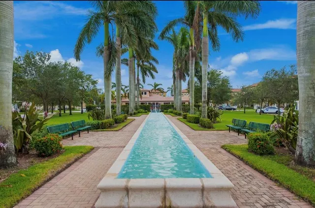 a view of a yard with palm trees