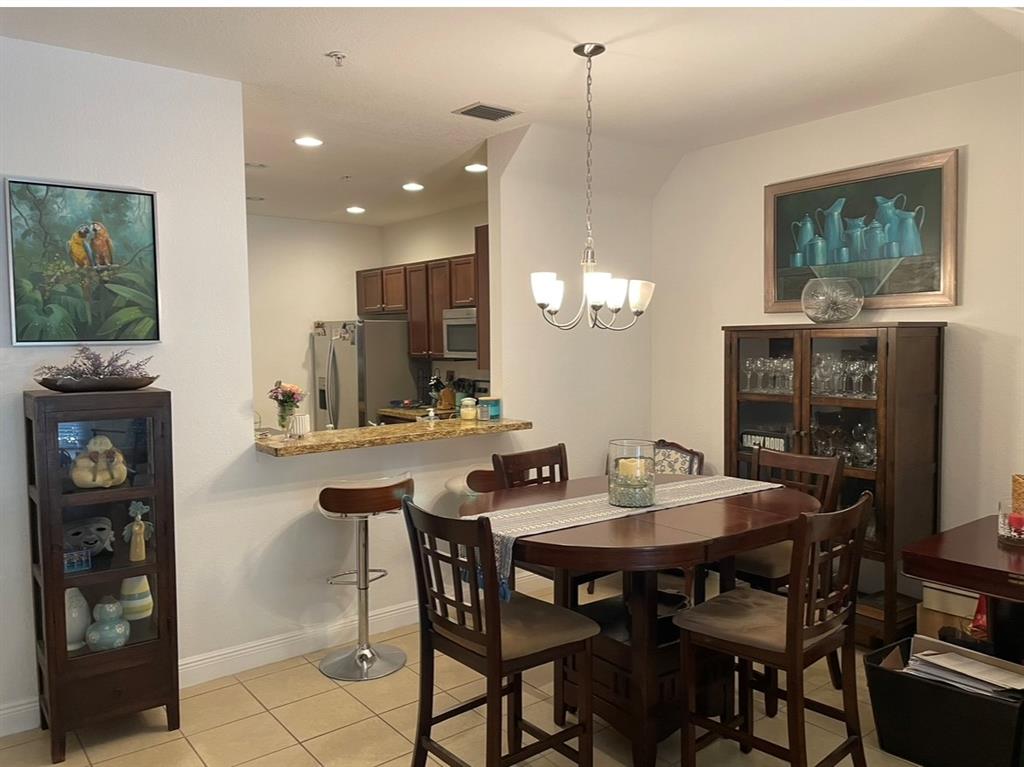 817 Southwest 147th Avenue, Unit 817 Pembroke Pines, FL 33027 - Photo 9 of 34 a view of a dining room with furniture