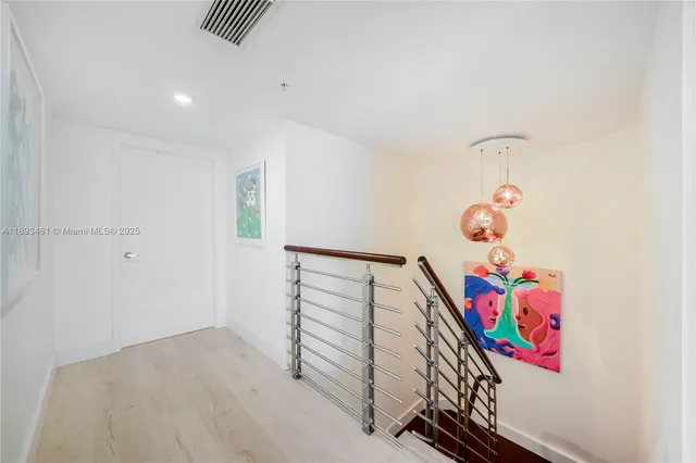 a view of entryway with stairs and wooden floor