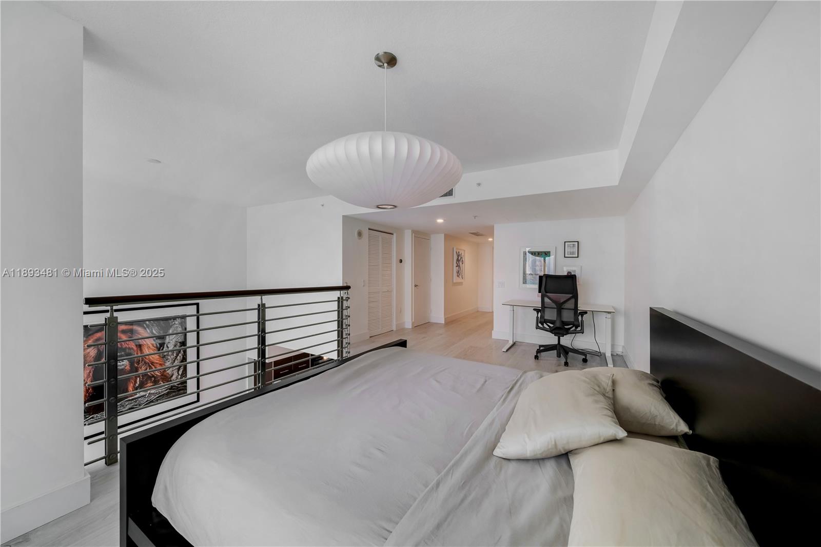 41 Southeast 5th Street, Unit 1709 Miami, FL 33131 - Photo 20 of 33 a bedroom with furniture and a window