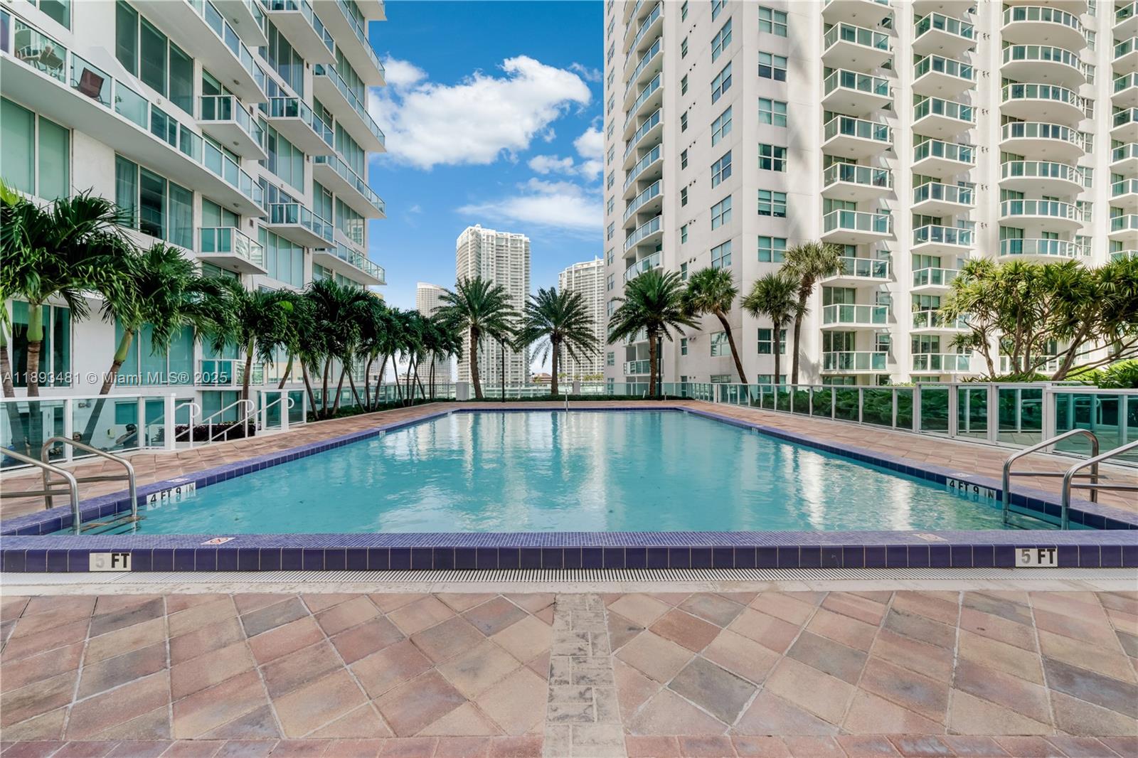 41 Southeast 5th Street, Unit 1709 Miami, FL 33131 - Photo 23 of 33 a view of swimming pool with outdoor seating and plants