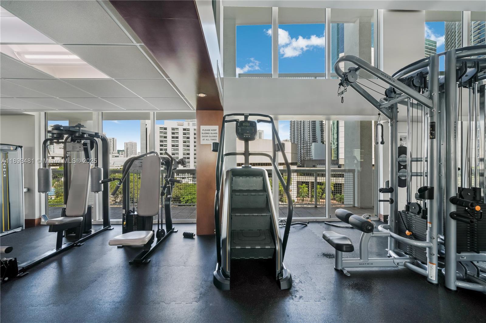 41 Southeast 5th Street, Unit 1709 Miami, FL 33131 - Photo 26 of 33 a gym room with gym equipment