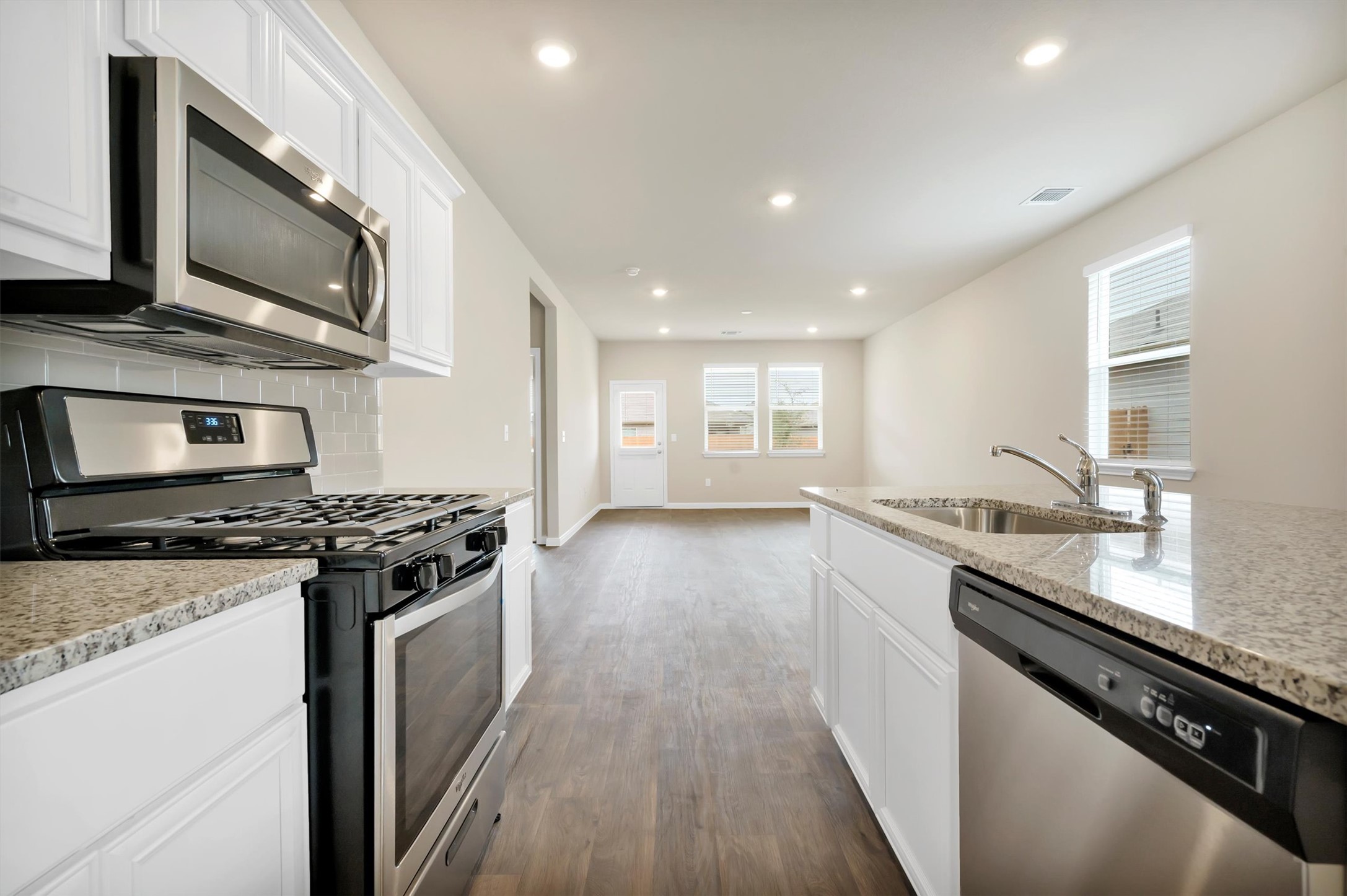 2909 Tweedy Trail Pflugerville, TX 78660 - Photo 18 of 27 A well-appointed kitchen showcasing contemporary appliances and stone countertops.