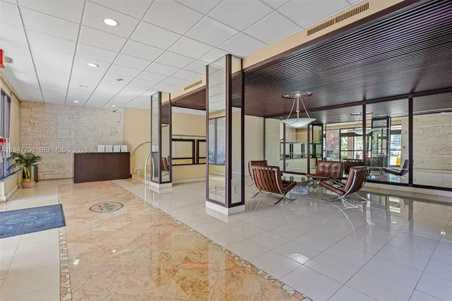 a room with lots of furniture and white walls