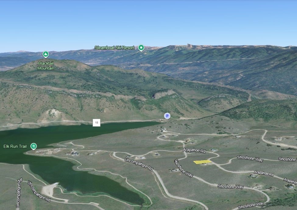 24395 Arapahoe Road Oak Creek, CO 80467 - Photo 3 of 9 a view of a golf course with a lake