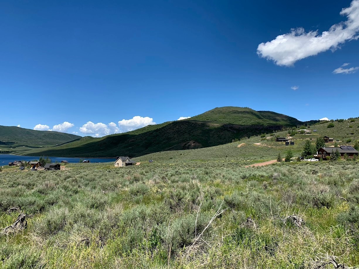 24395 Arapahoe Road Oak Creek, CO 80467 - Photo 9 of 9 a view of a lake in front of a building