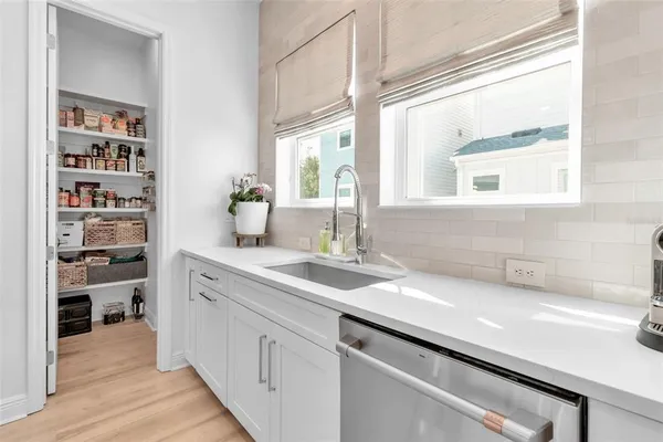 a kitchen with a sink and a window