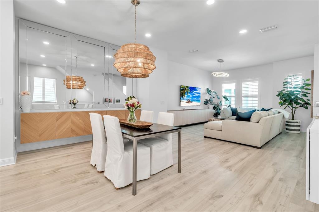 2554 Ruffing Court Sarasota, FL 34237 - Photo 15 of 32 a living room with furniture chandelier and kitchen view
