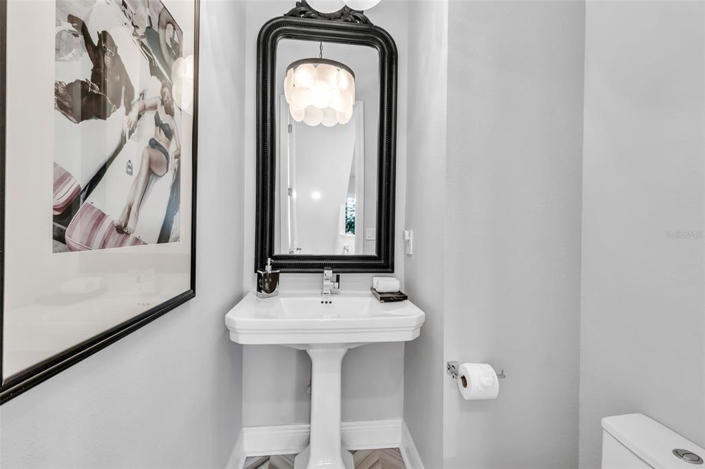 2554 Ruffing Court Sarasota, FL 34237 - Photo 20 of 32 a bathroom with a sink and a mirror