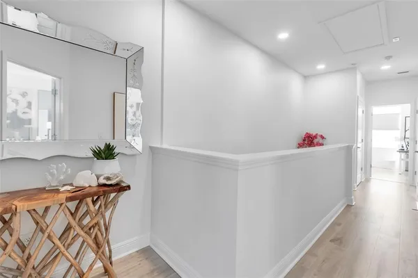 a room with furniture and a potted plant