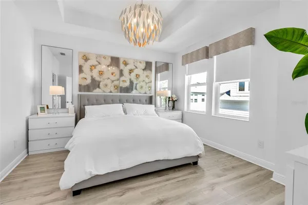 a large white bed in a white room