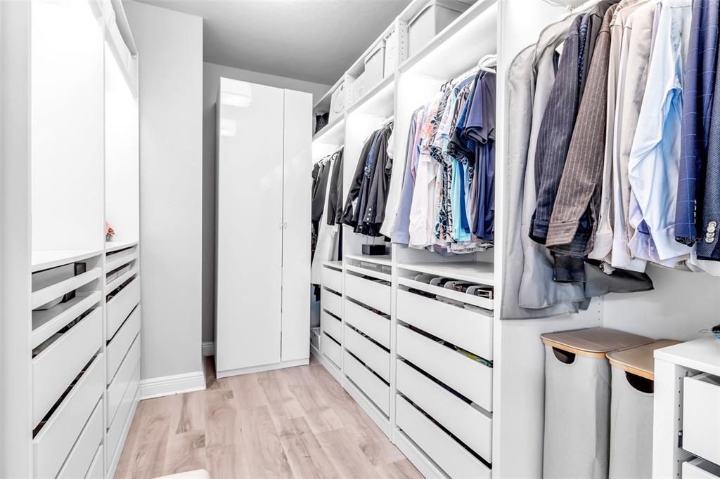 2554 Ruffing Court Sarasota, FL 34237 - Photo 25 of 32 a view of walk in closet with clothes and shoes