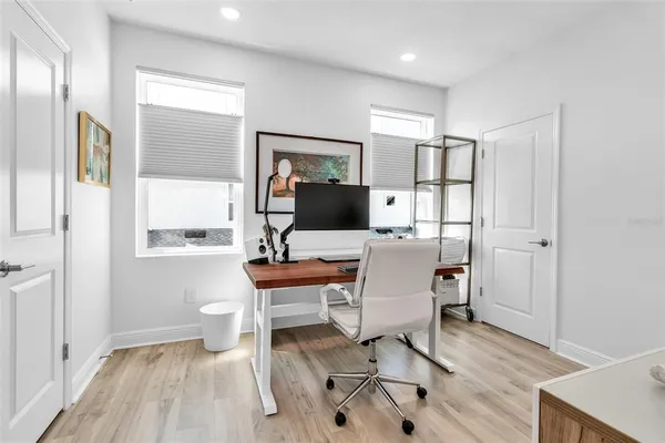 a workspace with furniture and window