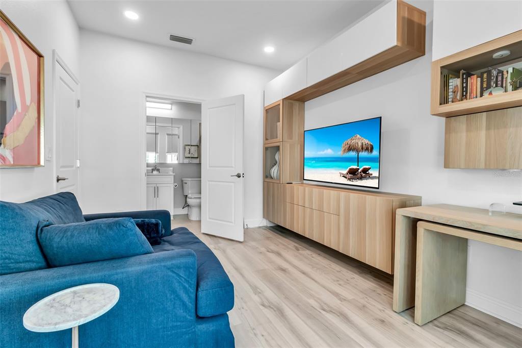 2554 Ruffing Court Sarasota, FL 34237 - Photo 6 of 32 a living room with furniture and a flat screen tv