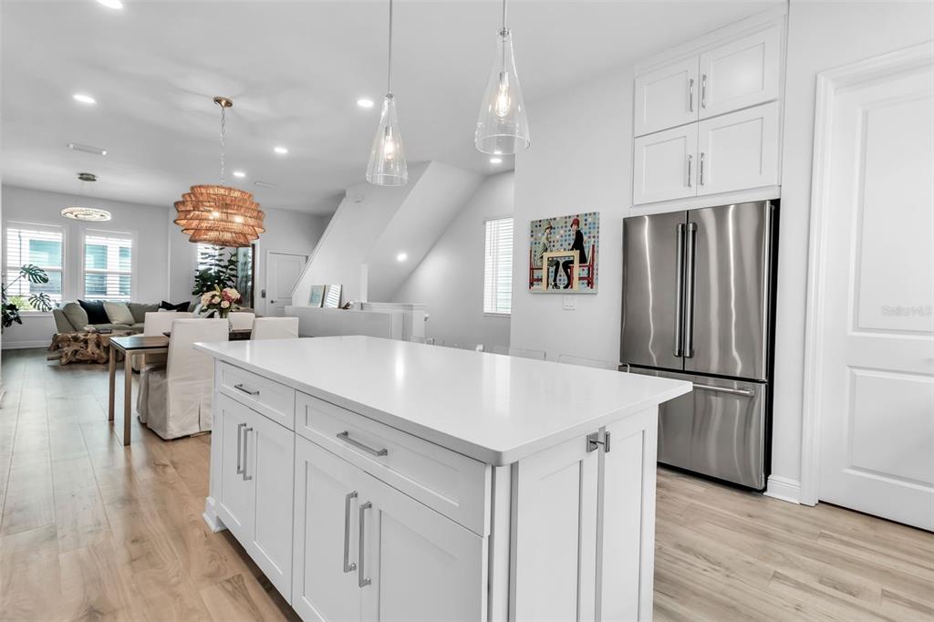 2554 Ruffing Court Sarasota, FL 34237 - Photo 9 of 32 a kitchen with stainless steel appliances kitchen island a refrigerator and a sink