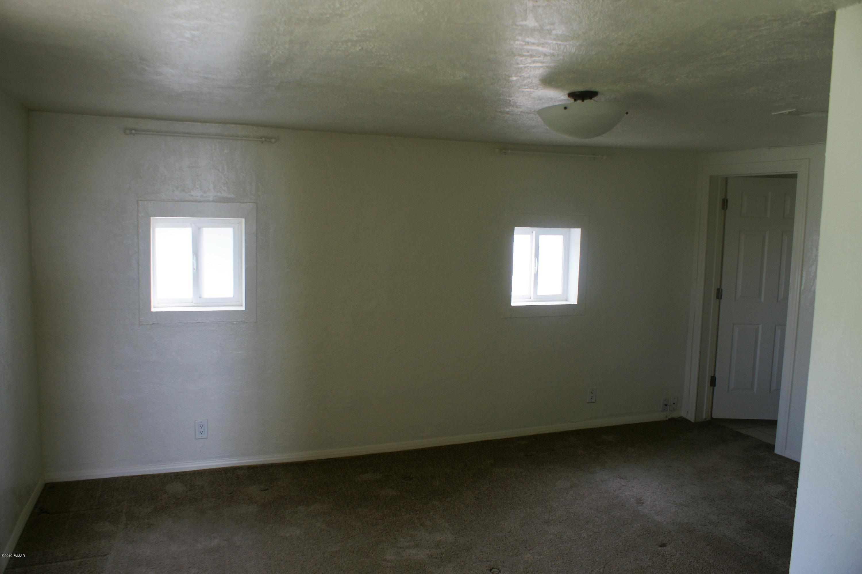 321 South 5th W Street Snowflake, AZ 85937 - Photo 15 of 32 an empty room with windows