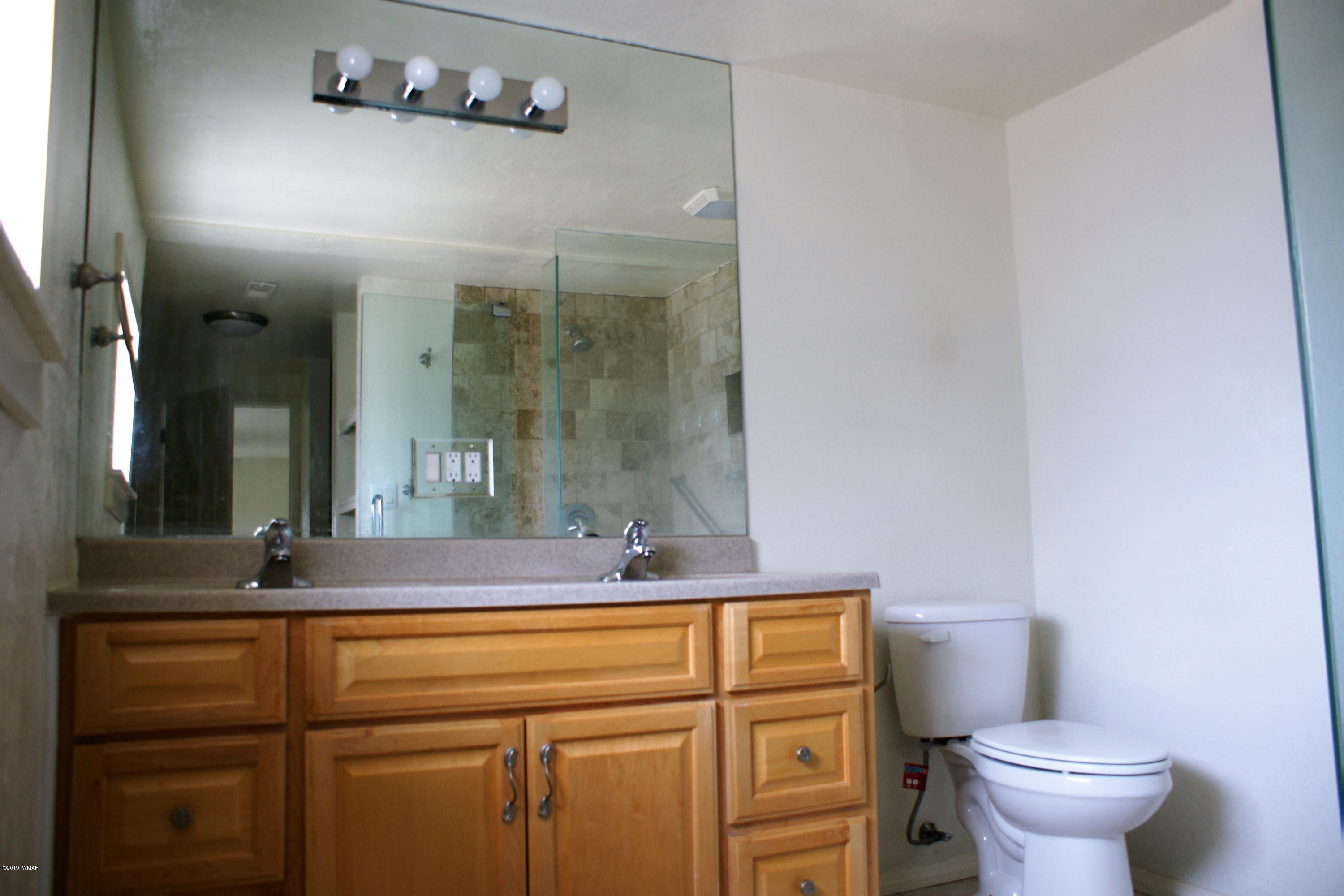 321 South 5th W Street Snowflake, AZ 85937 - Photo 17 of 32 a bathroom with a sink and a toilet