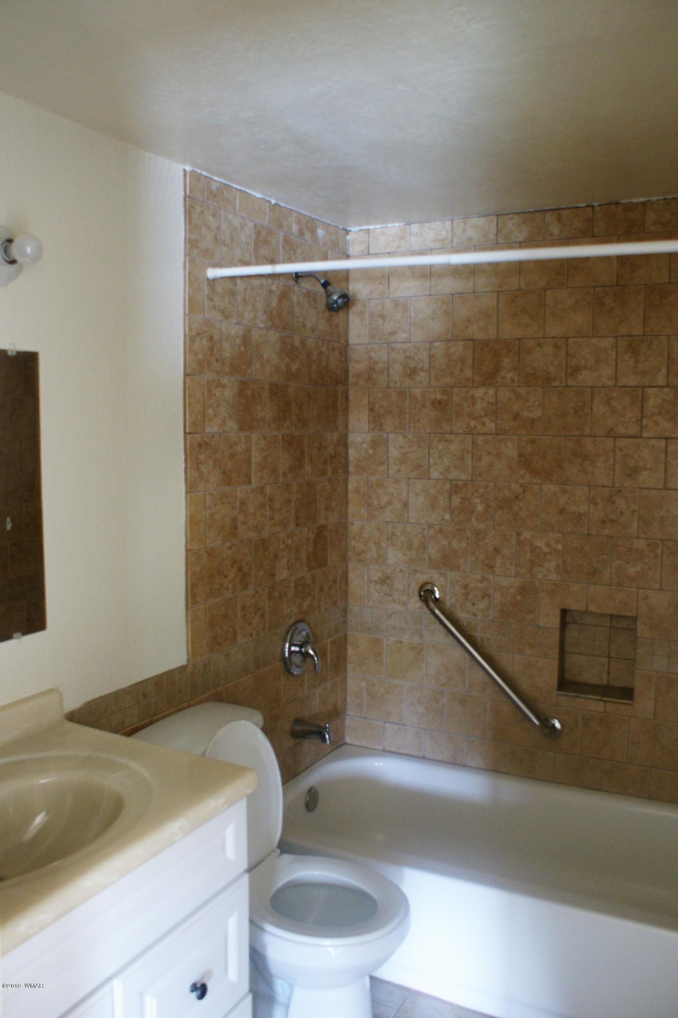 321 South 5th W Street Snowflake, AZ 85937 - Photo 20 of 32 a view of a bathroom with a tub and toilet