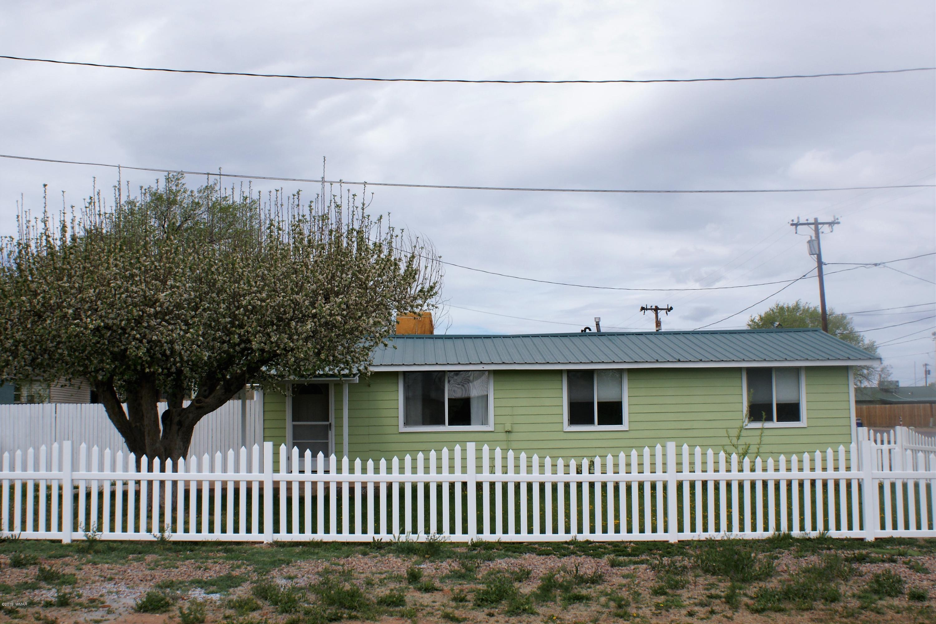 321 South 5th W Street Snowflake, AZ 85937 - Photo 2 of 32 a front view of a house with a garden