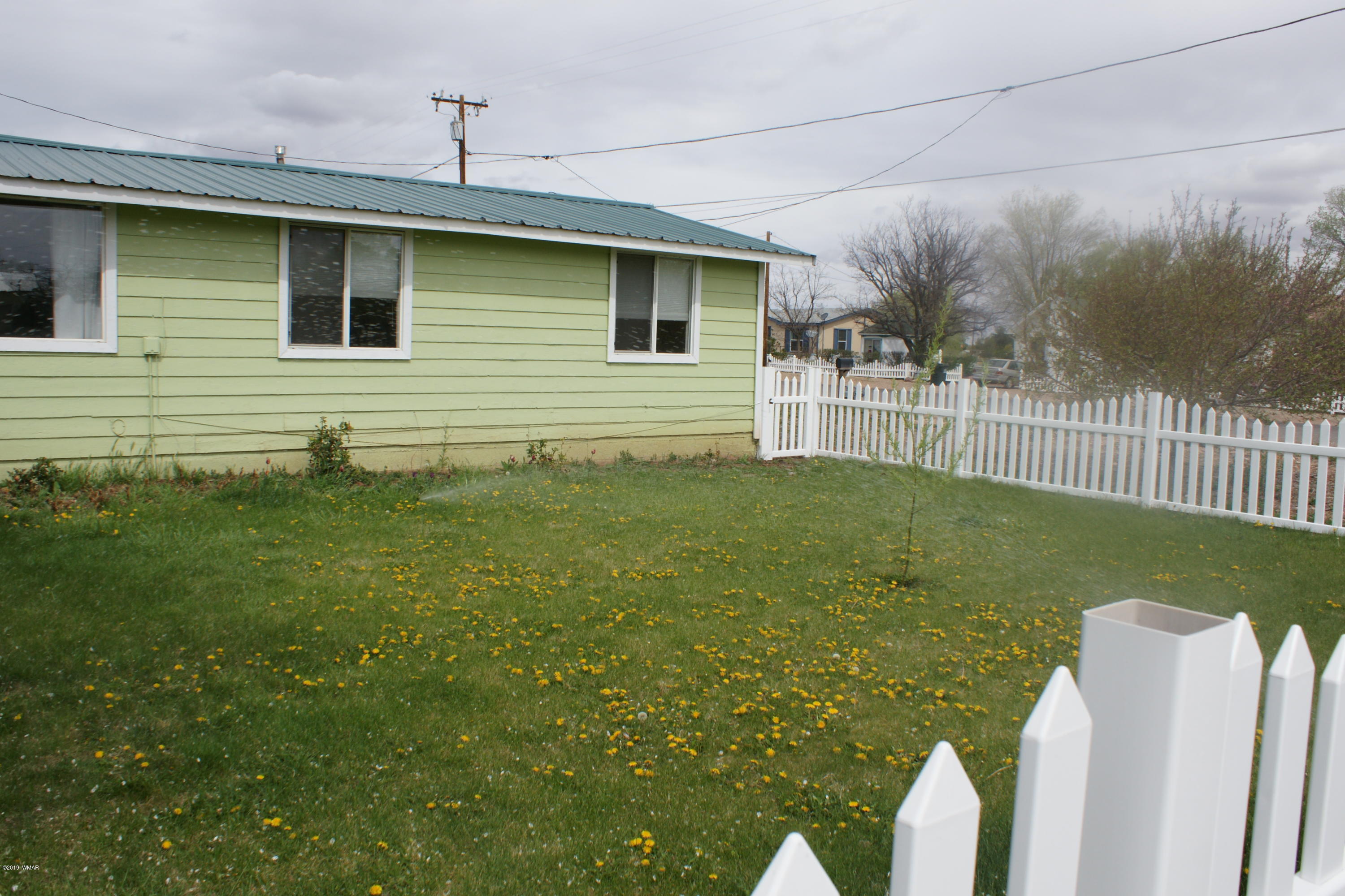 321 South 5th W Street Snowflake, AZ 85937 - Photo 28 of 32 a view of a house with a backyard