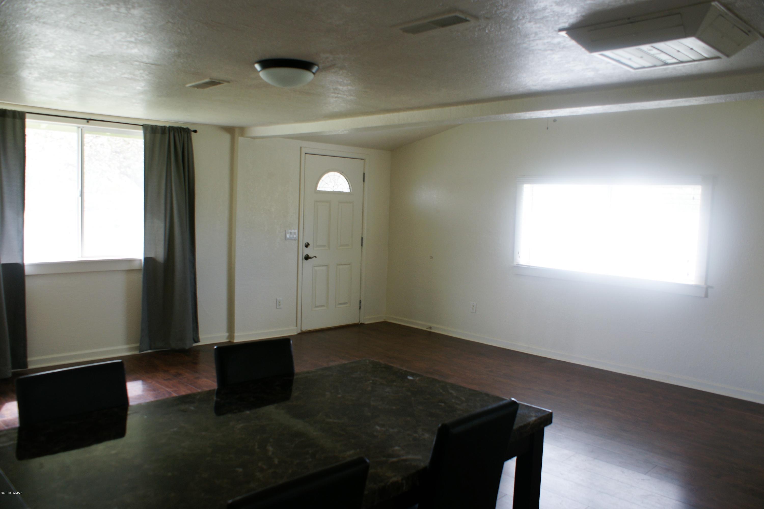 321 South 5th W Street Snowflake, AZ 85937 - Photo 9 of 32 an empty room with windows