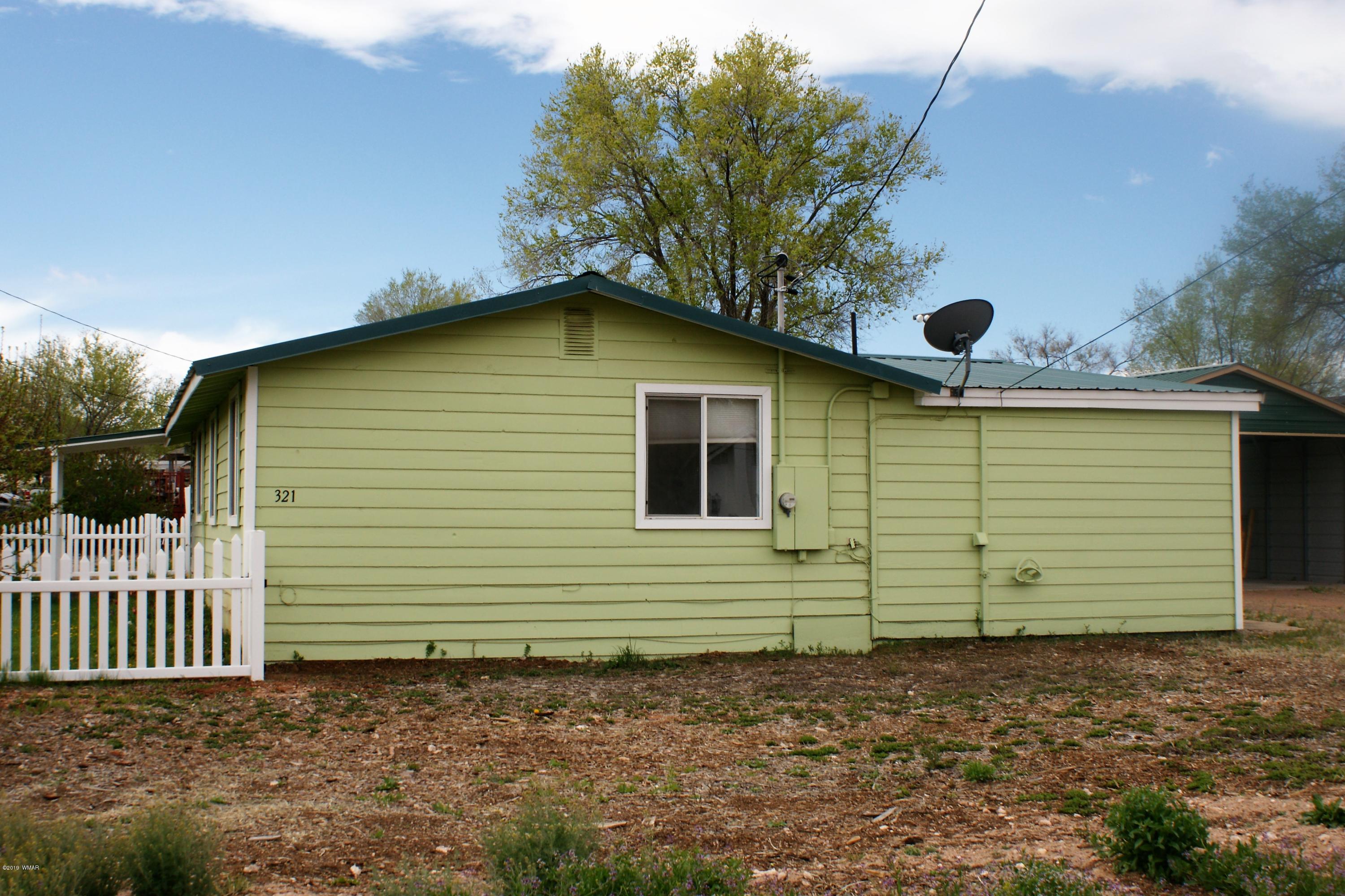 321 South 5th W Street Snowflake, AZ 85937 - Photo 10 of 32 a side view of a house with a yard