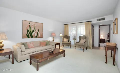 a living room with furniture and a large window