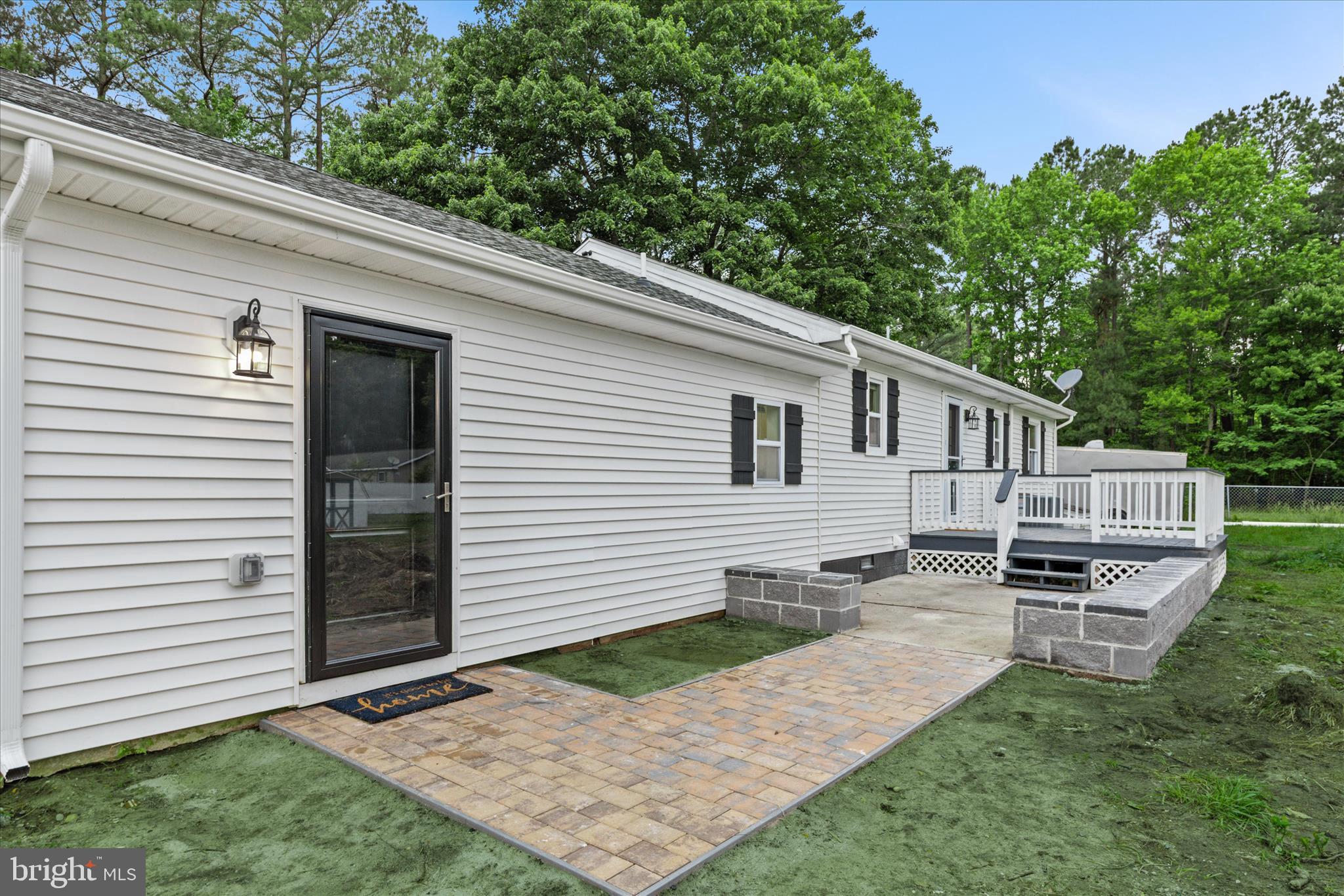 11477 Pine Pole Road Princess Anne, MD 21853 - Photo 21 of 33 Stone Walkway, Wood Deck and Concrete Patio