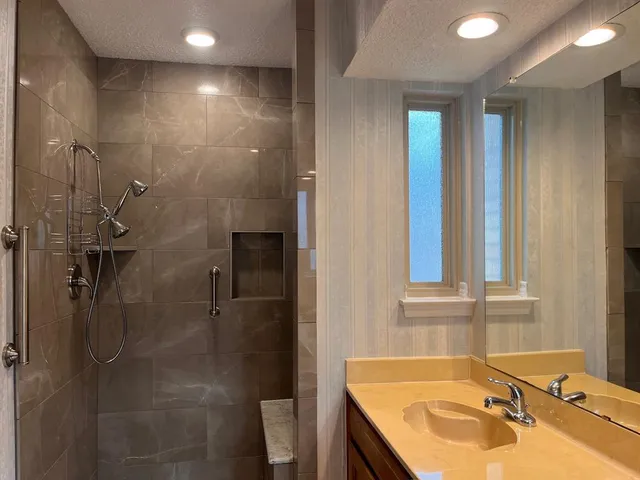 a bathroom with a sink and a shower