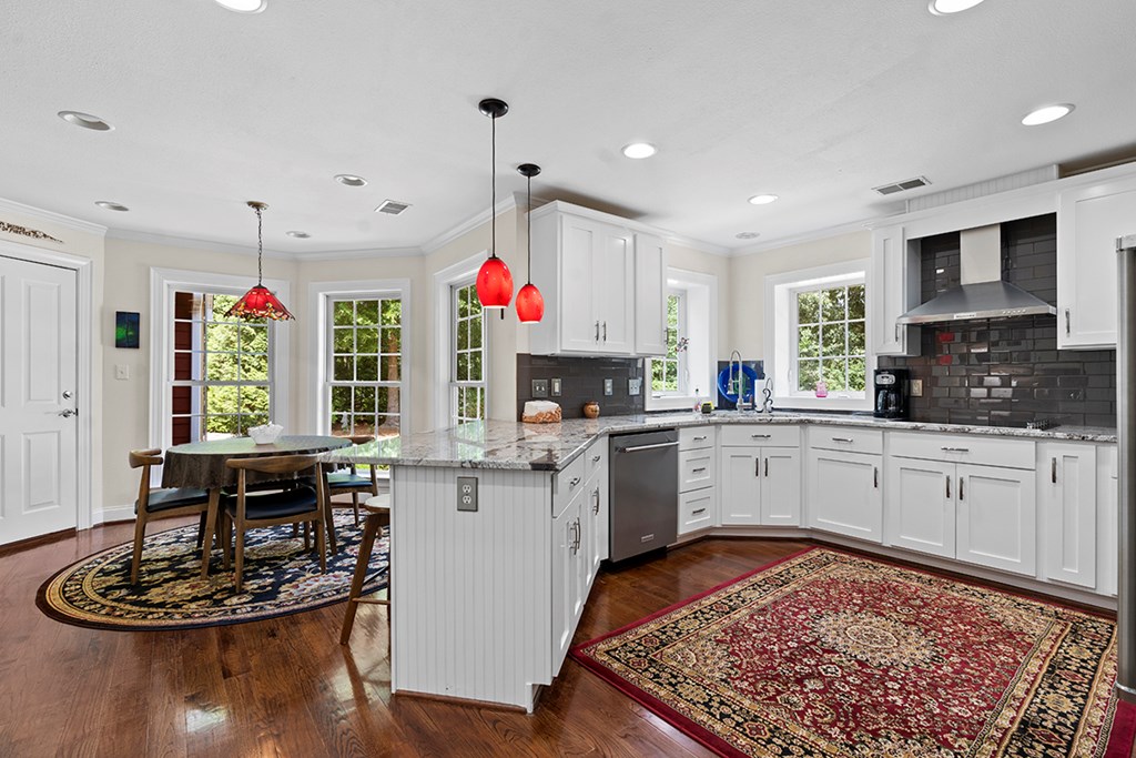 337 Compass Point Ninety Six, SC 29666 - Photo 13 of 43 a kitchen with a white dining table cabinets and window