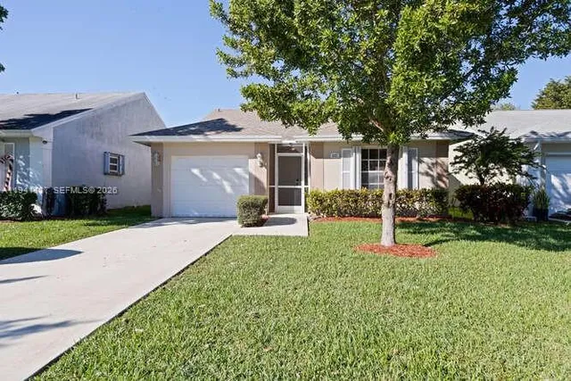 a view of a backyard of the house