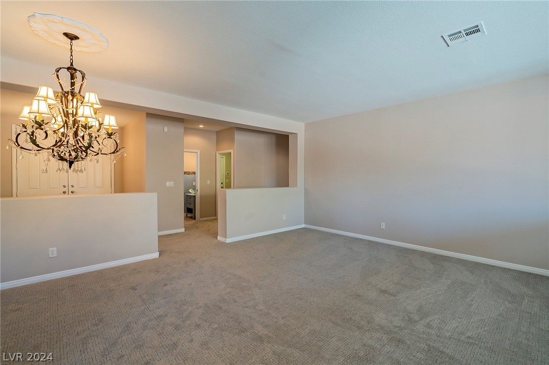 7858 Midnight Ride Street Las Vegas, NV 89131 - Photo 2 of 24 Enter the double doors into the living area.