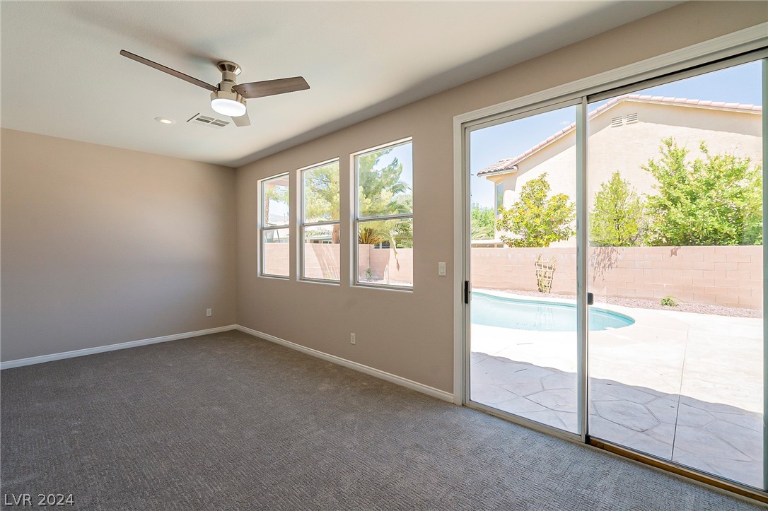 7858 Midnight Ride Street Las Vegas, NV 89131 - Photo 5 of 24 Plenty of windows and a ceiling fan for comfort.