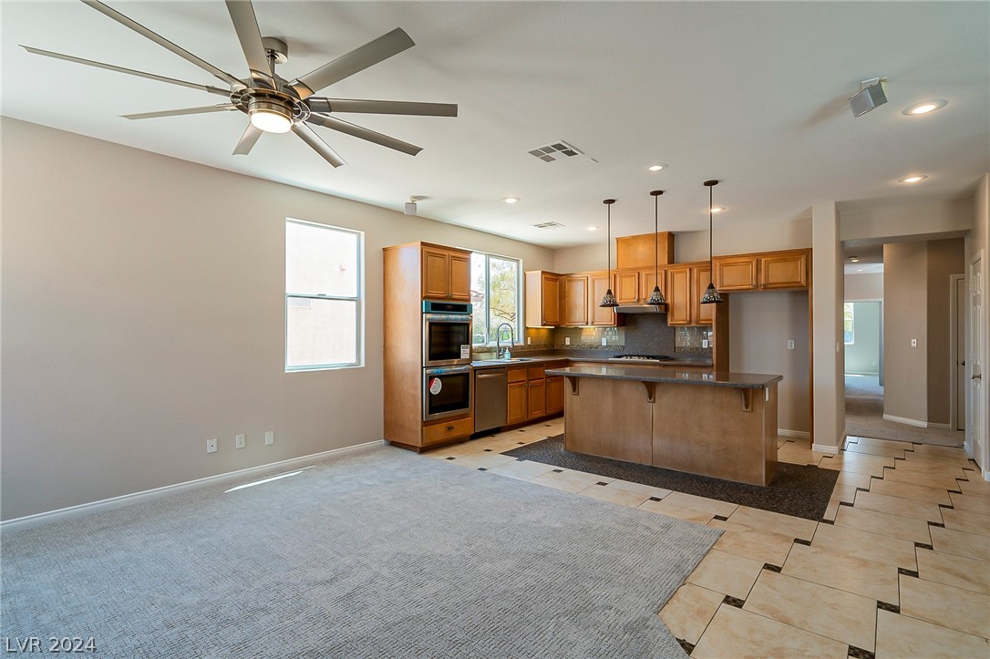 7858 Midnight Ride Street Las Vegas, NV 89131 - Photo 8 of 24 Open floor kitchen with pendant lighting and new a