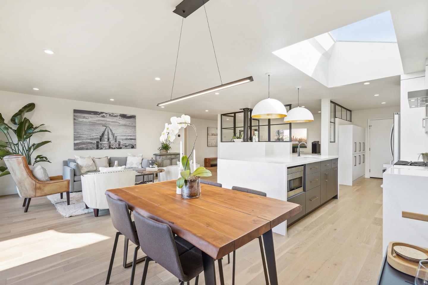 1914 Bishop Road Belmont, CA 94002 - Photo 11 of 79 a kitchen with a table chairs and white cabinets