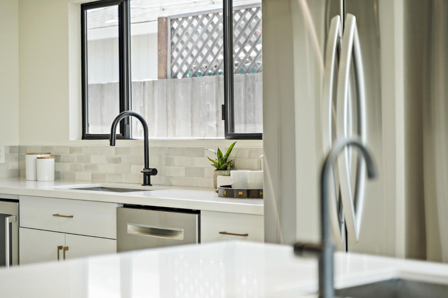 1914 Bishop Road Belmont, CA 94002 - Photo 17 of 79 a kitchen with stainless steel appliances granite countertop a refrigerator sink and cabinets