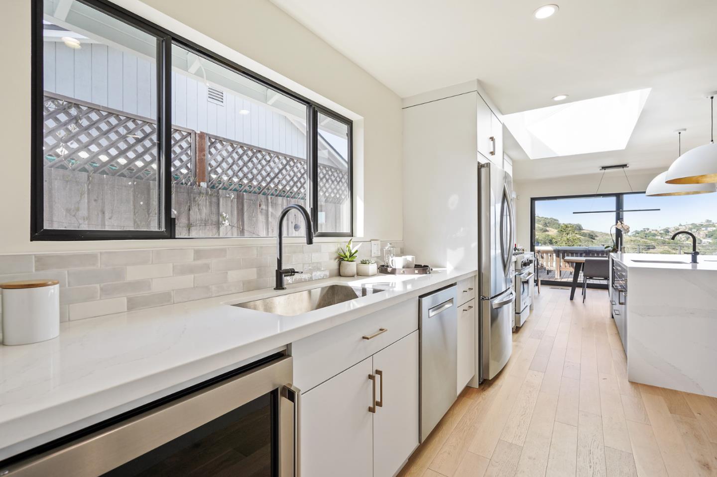 1914 Bishop Road Belmont, CA 94002 - Photo 19 of 79 a kitchen with a sink cabinets and wooden floor