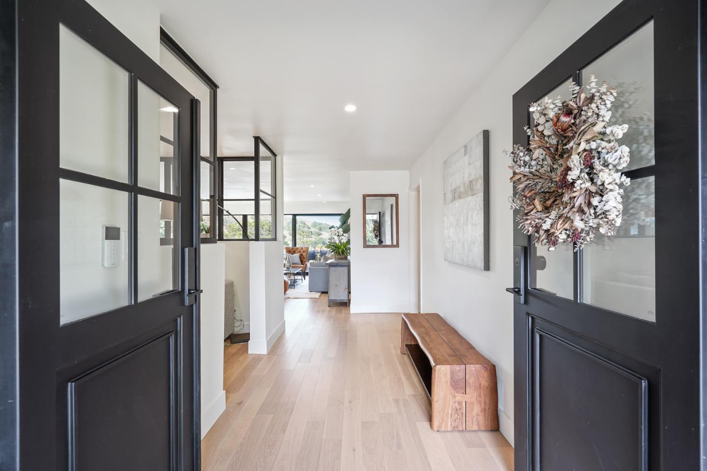 1914 Bishop Road Belmont, CA 94002 - Photo 3 of 79 a hallway with a large window and wooden floor