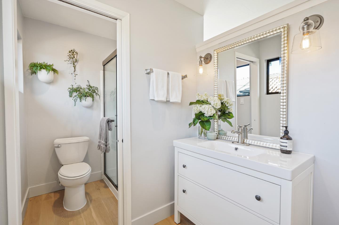 1914 Bishop Road Belmont, CA 94002 - Photo 36 of 79 a bathroom with a toilet sink and mirror