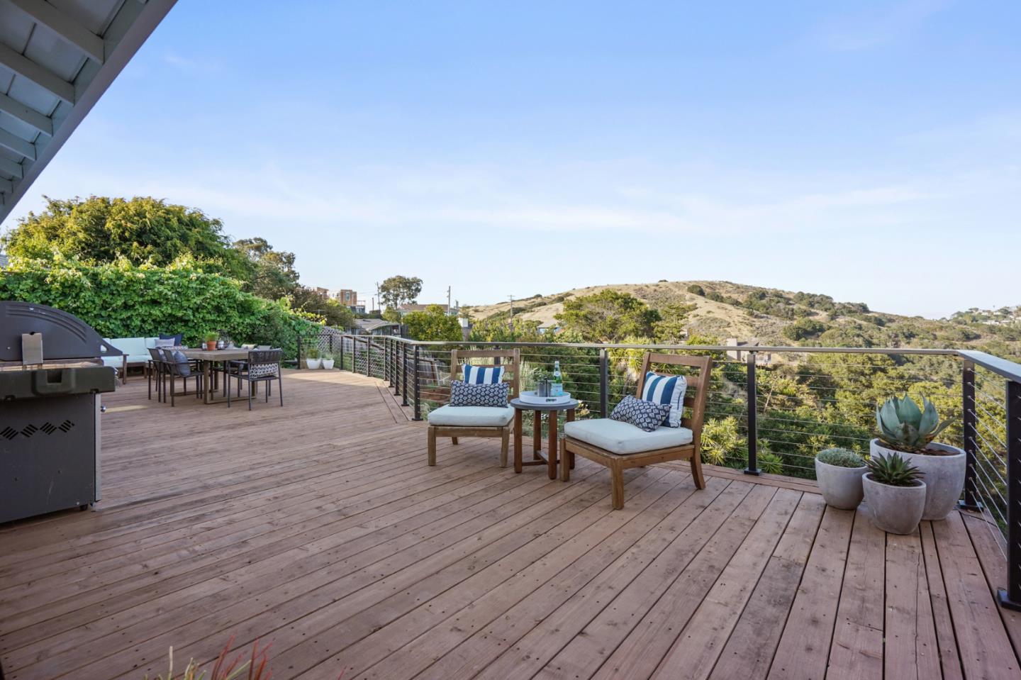 1914 Bishop Road Belmont, CA 94002 - Photo 52 of 79 a view of a balcony with chair and wooden floor