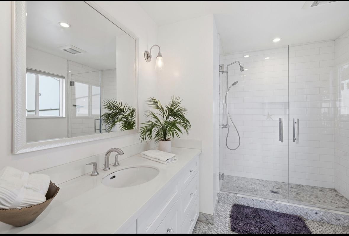 229 Rio Del Mar Boulevard Aptos, CA 95003 - Photo 20 of 27 a bathroom with a sink a toilet and shower