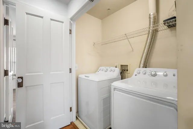 a front view of a residential apartment building with a yard