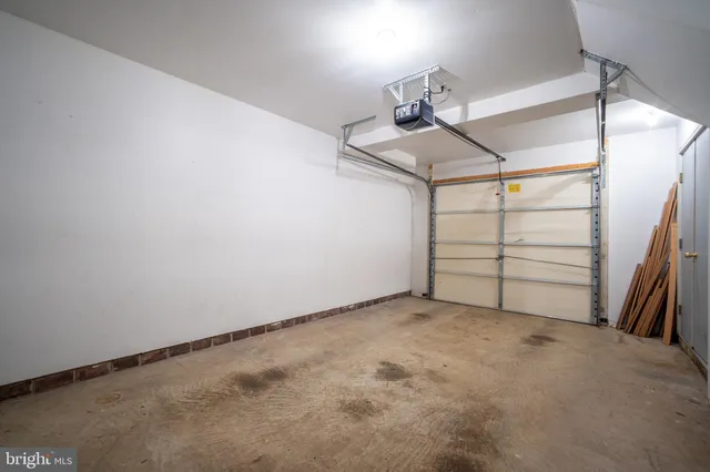 a front view of a residential apartment building with a yard