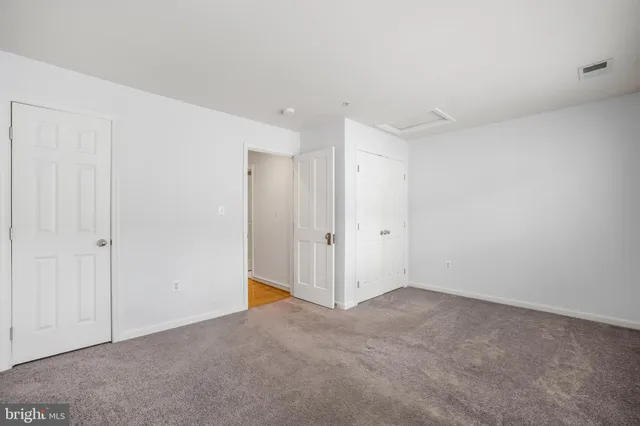 a picture of a bench in a white building