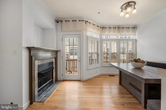 a kitchen with granite countertop a stove top oven a sink and a refrigerator